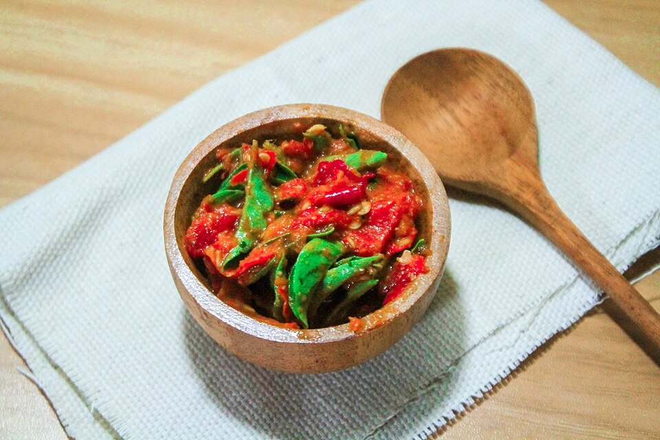 Green chili sambal in a wooden bowl